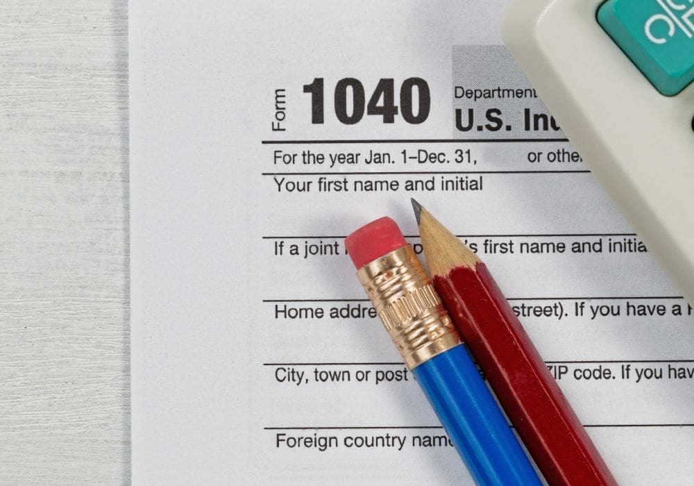 A pair of pencils sitting on top of an irs form.